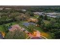 An aerial view of a beautiful single Gathering home surrounded by lush greenery and trees at 512 Creekside Ct, Safety Harbor, FL 34695