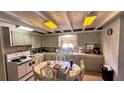 Bright kitchen featuring white appliances, ample counter space, and a breakfast nook at 5719 13Th E St, Bradenton, FL 34203