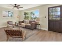 Comfortable living room with modern decor, fan, and a view to the front yard at 6220 Pershing Ne St, St Petersburg, FL 33702