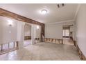 Spacious living room featuring tile flooring and wood-paneled accents undergoing renovation at 647 74Th N Ave, St Petersburg, FL 33702