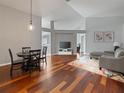 Bright living room with hardwood floors, high ceilings, and neutral paint, flowing to other spaces at 9008 Egret Cove Cir, Riverview, FL 33578