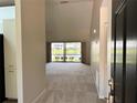 Inviting foyer with a view to the living area and scenic lake, enhanced by natural light at 907 San Carlos Ne Ave, St Petersburg, FL 33702
