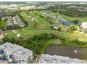 Aerial view of a condo community with a golf course nearby at 960 Starkey Rd # 2103, Largo, FL 33771