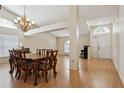 Spacious dining room featuring hardwood floors, chandelier, and easy access to other rooms at 11638 Branch Mooring Dr, Tampa, FL 33635