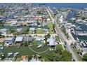 Aerial view of home with waterfront access to the Gulf, a boat lift, and circular boundary line at 13928 Raie Ave, Hudson, FL 34667