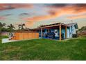 Private backyard with a spacious wooden deck, perfect for outdoor entertaining at 13978 Barbados Dr, Seminole, FL 33776