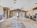 Spacious living room awaiting renovation with open floor plan at 14808 Lake Magdalene Cir, Tampa, FL 33613