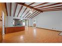 Bright living room features exposed wood beams, hardwood floors, and an open layout at 1579 Palmetto St, Clearwater, FL 33755