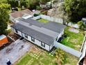 Aerial view of the home, showcasing backyard, driveway and roof at 1813 E Wood St, Tampa, FL 33604