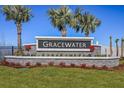 Gracewater community entrance featuring manicured landscaping, stone accents, and inviting signage at 2797 Marrakesh Ln, Sarasota, FL 34234