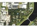 Aerial view showcasing the lot location near Garden Lane surrounded by trees and commercial areas at 4210 Garden Ln, Tampa, FL 33610