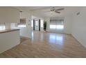 The expansive living room boasts natural light and wood floors leading to other rooms at 4851 W Gandy Blvd # B12L23, Tampa, FL 33611