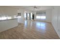 A spacious living room filled with natural light, wood floors, and an open layout at 4851 W Gandy Blvd # B12L23, Tampa, FL 33611