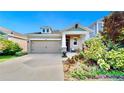 Charming home with two-car garage, inviting front porch and beautiful landscaping at 5645 Del Coronado Dr, Apollo Beach, FL 33572