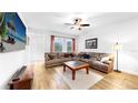 Comfortable living room with ample natural light and cozy sectional sofa at 5645 Del Coronado Dr, Apollo Beach, FL 33572