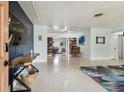 Bright living area showcasing sleek terrazzo flooring, stylish furnishings, and an inviting open layout at 5961 36Th Ave N, St Petersburg, FL 33710
