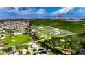 Aerial view of neighborhood, highlighting neighborhood proximity to the water at 6512 Simone Shores Cir, Apollo Beach, FL 33572