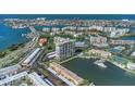 Captivating aerial shot displays a condo building nestled beside a tranquil waterway and lush landscaping at 7300 Sun Island S Dr # 1505, South Pasadena, FL 33707