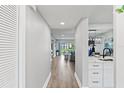 Bright hallway with views of living room and kitchen at 11510 Shipwatch Dr # 1372, Largo, FL 33774