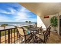 Relaxing balcony with seating and ocean views, perfect for enjoying the beach breeze and sunshine at 15000 Gulf Blvd # 407, Madeira Beach, FL 33708