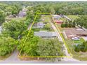 Aerial view of the property, showcasing the home's location with its boundaries outlined at 1607 Bell Shoals Rd, Brandon, FL 33511