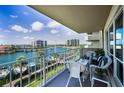 Enjoy this balcony with comfortable seating overlooking the beautiful water and boat docks at 1621 Gulf Blvd # 407, Clearwater Beach, FL 33767