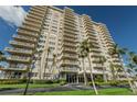 Beautiful condo exterior showcasing multiple balconies and a well-maintained green space at 1621 Gulf Blvd # 407, Clearwater Beach, FL 33767