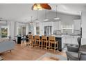 Gourmet kitchen features a large center island with counter seating and stainless steel appliances at 3315 W Hawthorne Rd, Tampa, FL 33611