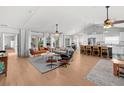 Open-concept living area features hardwood floors, soaring ceilings, and modern decor at 3315 W Hawthorne Rd, Tampa, FL 33611
