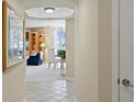 Hallway view into dining and living area with water views at 4953 Bacopa S Ln # 205, St Petersburg, FL 33715