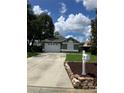 Inviting single-story home with a well-kept lawn and a convenient mailbox by the driveway at 6905 Summer Harbor Ln, Riverview, FL 33578