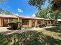 Lovely single story home features a well-kept yard with beautiful bushes and attractive awnings at 8320 High Point Cir # 5, Port Richey, FL 34668