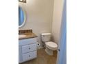 Functional half bathroom showcasing granite counter, white vanity, and modern fixtures at 850 S Tamiami Trl # 424, Sarasota, FL 34236