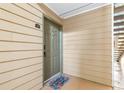 Cozy condo entrance featuring a welcome mat and the unit number 1504 at 9481 Highland Oak Dr # 1504, Tampa, FL 33647