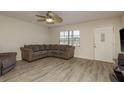 Cozy living room with neutral tones and new floors at 10623 103Rd St, Largo, FL 33773