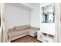 Cozy living area with hardwood floors, a sofa, and cabinet at 111 N 12Th St # 1805, Tampa, FL 33602