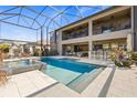 Relaxing outdoor living space with pool, hot tub, outdoor seating and outdoor kitchen with bar at 13019 Wildflower Meadow Dr, Riverview, FL 33579