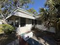 A home with an inviting front porch area and landscaping at 1835 15Th S Ave, St Petersburg, FL 33712