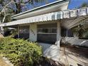 Close up of home with covered porch and well established landscaping at 1835 15Th S Ave, St Petersburg, FL 33712