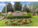 Oakstead community sign with brick columns and lush landscaping at 19204 Weymouth Dr, Land O Lakes, FL 34638