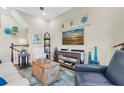 Cozy living area showcasing stylish decor, comfortable seating, and staircase at 204 Haven Beach Ct, Indian Rocks Beach, FL 33785