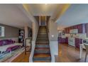 Interior view of entryway stairs connecting to the kitchen, living room and hardwood flooring at 2412 Burlington N Ave, St Petersburg, FL 33713