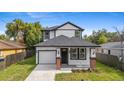 Charming two-story home with black trim, columns with brick bases, and a well-maintained lawn at 3105 E Osborne Ave, Tampa, FL 33610