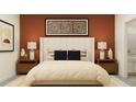 Comfortable main bedroom featuring warm colors, coordinated decor, and ample natural light at 32066 Griffin Sands Ln, San Antonio, FL 33576