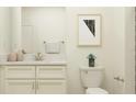 Bright bathroom featuring a white vanity with a marble countertop and modern fixtures at 32110 Griffin Sands Ln, San Antonio, FL 33576