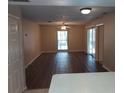 Bright living room featuring modern flooring, lots of light, and an open concept with a ceiling fan at 4111 Ashford Green Pl # B203, Tampa, FL 33613