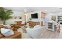 Inviting living room featuring stylish decor, comfortable seating, and a bright, open layout with kitchen views at 4492 Kingston Dr, Hernando Beach, FL 34607