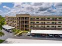 Exterior of multi-story condo building with multiple balconies and covered parking at 6190 80Th N St # 310, St Petersburg, FL 33709