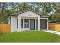 Picture of this cozy one-story home with updated paint and a driveway at 7509 E 26Th Ave, Tampa, FL 33619