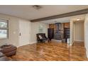 Inviting living room features a fireplace, wood flooring and beamed ceiling at 11320 125Th Ter, Largo, FL 33778